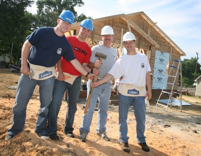 Volunteers building a house